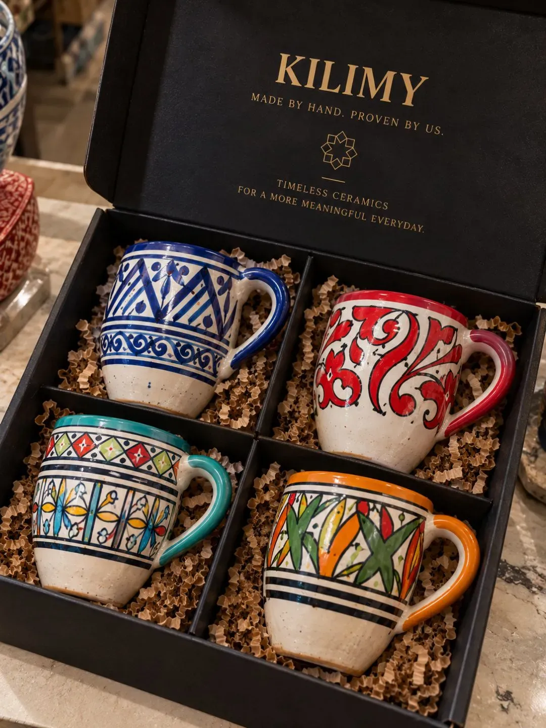 KILIMY gift box containing four handmade Moroccan ceramic mugs with protective packaging and branded presentation.