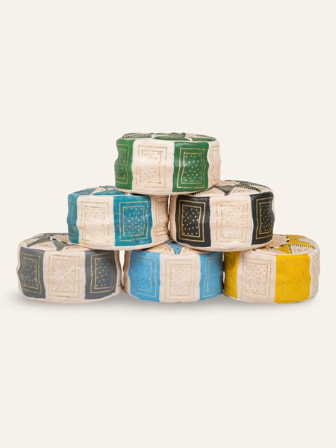 Collection of Moroccan leather poufs in assorted colors and geometric patterns