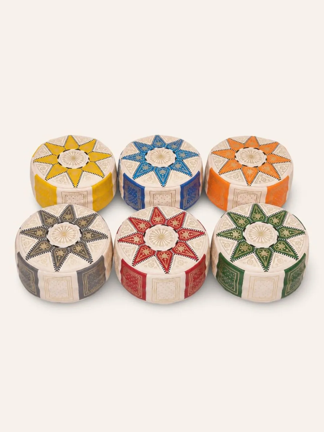 Handmade Moroccan leather poufs in multiple colors and geometric patterns