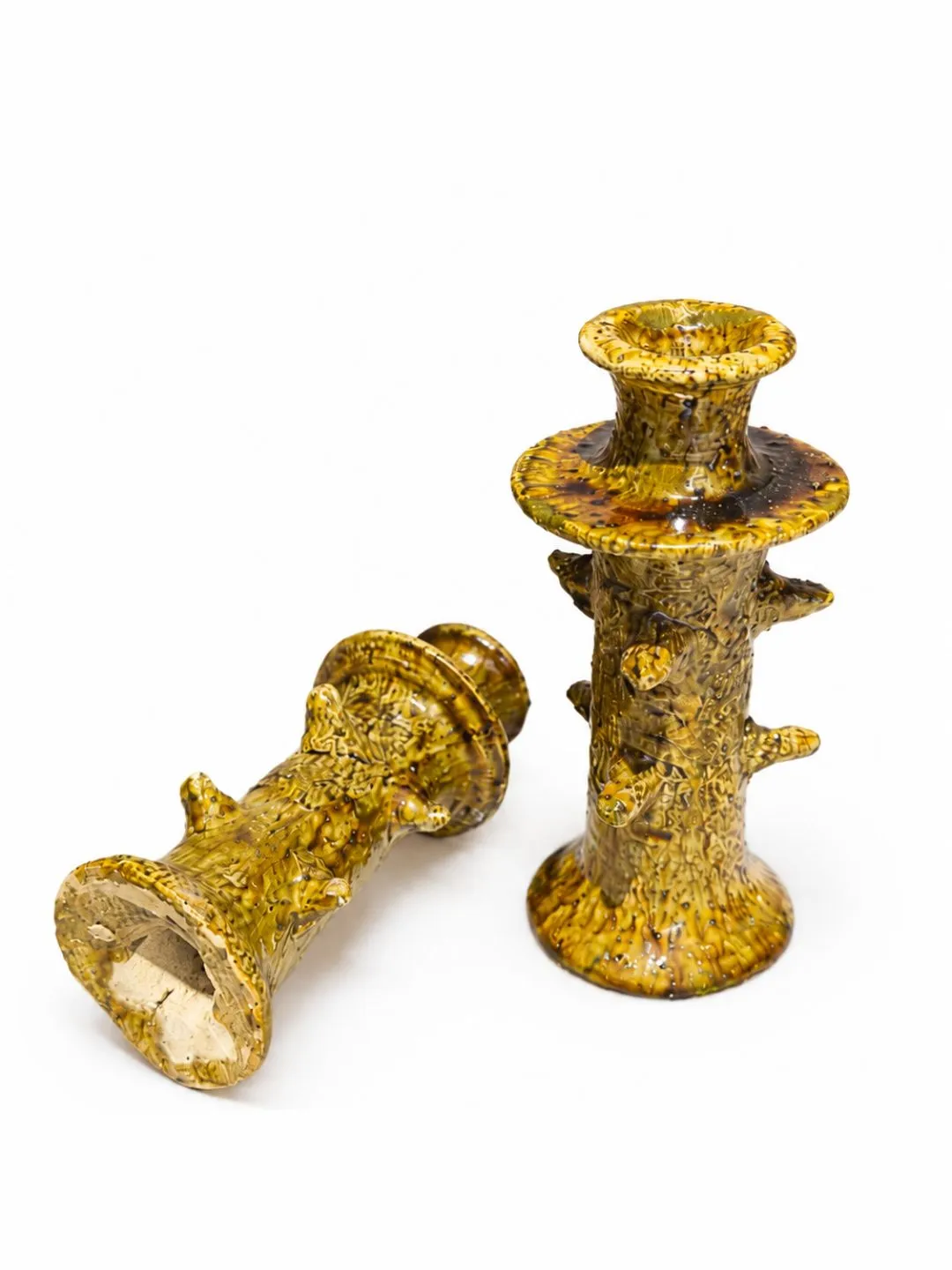 Pair of ochre-yellow glazed Tamegroute ceramic candle holders, shown upright and lying down